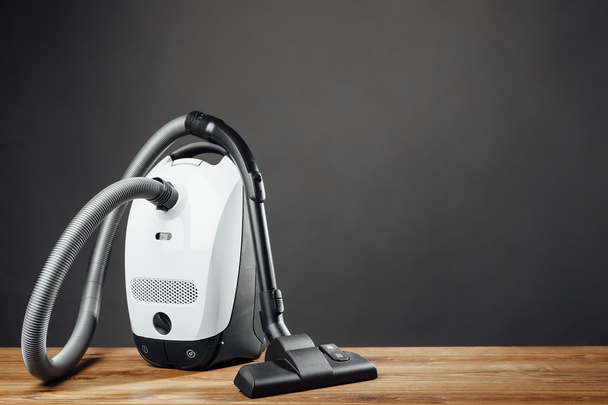 vacuum cleaner on grey background - Photo, Image