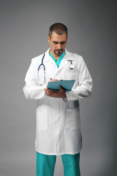 Doctor with prescription board in hands - Photo, image