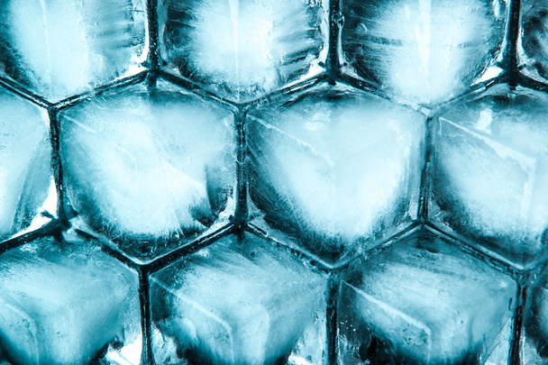Honeycomb ice cubes background top view - Foto, afbeelding