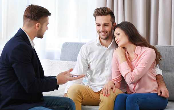 Estate agent with couple - Photo, image