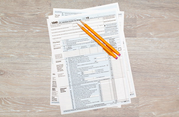 Pencils laying on 2015 IRS form 1040 - Fotó, kép