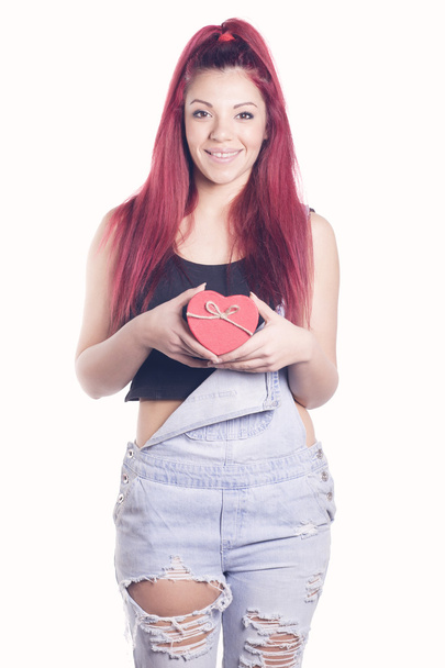 Happy redhead girl with gift heart shaped box - Valokuva, kuva