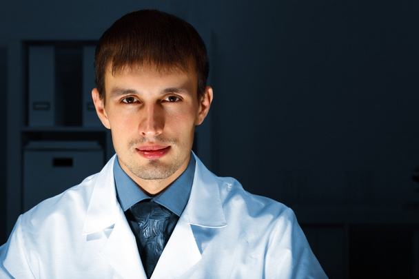 Young chemist working in laboratory - Фото, изображение
