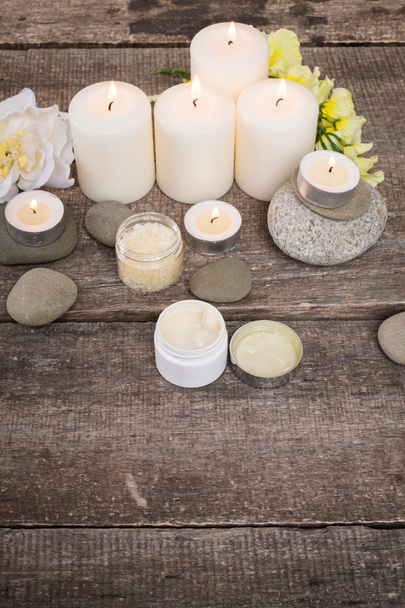 candle and stones on wooden background - Foto, imagen