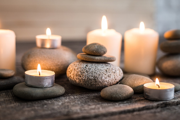 grey stones, candle - Фото, изображение