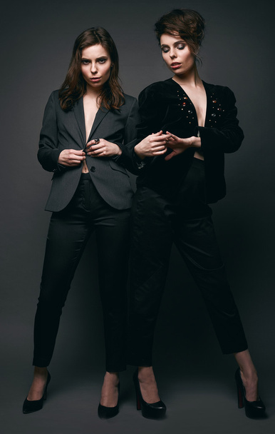 Portrait of two beautiful, sensual brunette models-twins - 写真・画像