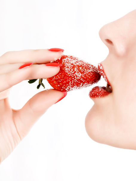 Woman's mouth with red strawberry - Photo, Image