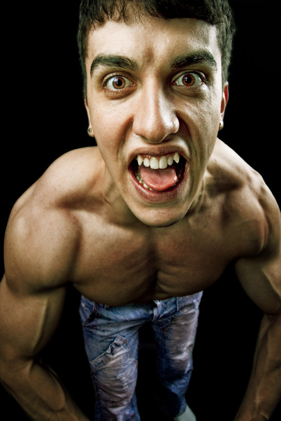 Muscular man making a funny face - Photo, Image