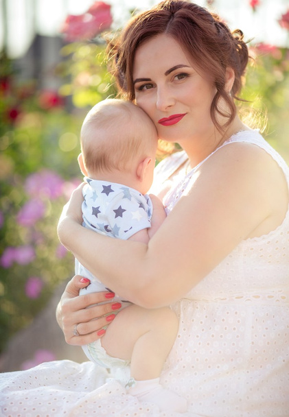 mother with baby boy in garden - Foto, imagen