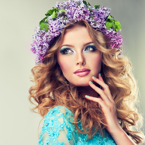 beautiful woman with lilac wreath - Photo, Image