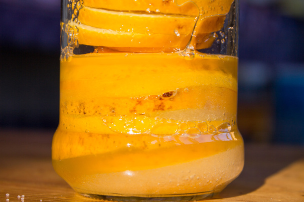 lemon slices and sugar in a glass jar - Fotoğraf, Görsel