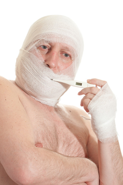 Man with bandage on head. Looking unhappy at something. - Foto, Imagen