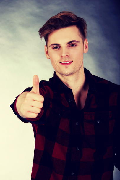 handsome man with thumb up sign. - Photo, image