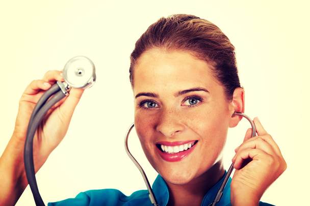 Young female doctor with stethoscope - Foto, Imagen