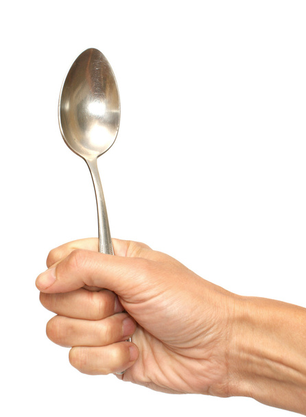 κουτάλι σε ένα χέρι - Φωτογραφία, εικόνα