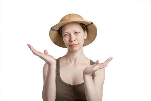 Young woman in a tropical helmet with hands palms up - Photo, Image