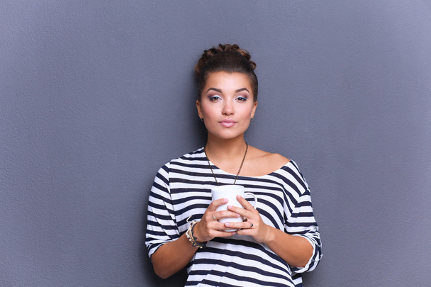 Portrait of  young woman with cup  tea or coffee - Fotoğraf, Görsel