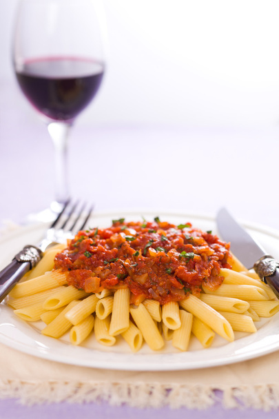 Arrabiatta pasta and wine - Photo, Image