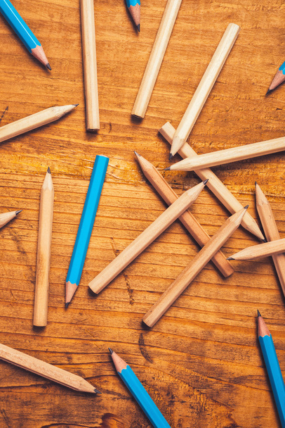 Scattered pencils on rustic wooden table - Fotografie, Obrázek