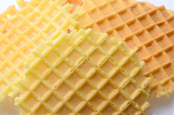 Hill round yellow crispy waffles on a white background. breakfas - Fotoğraf, Görsel