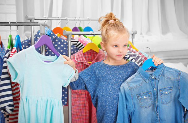 Little girl trying on clothes - Foto, Imagem
