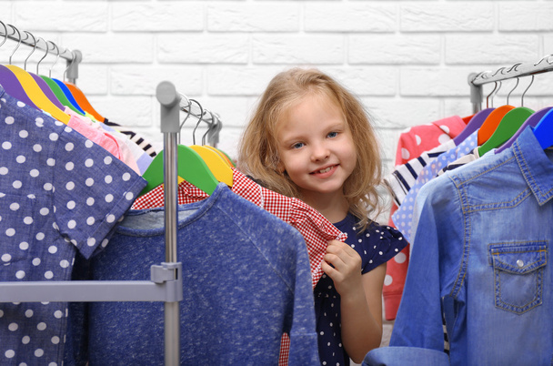 Little girl trying on clothes - Photo, image