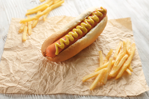 Hot dog and fried potatoes - Фото, изображение