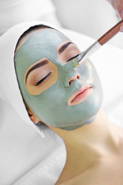 Young woman with nutrient facial mask - Photo, image