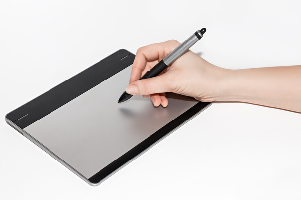 Graphic tablet, hand and feather  - Photo, image
