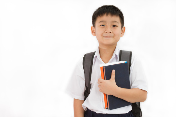 Asian Little School Boy Holding Books with Backpack - 写真・画像