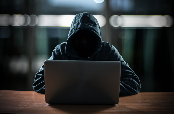 Hacker in front of his computer - Foto, Imagen