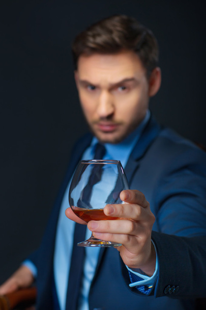Intelligent man drinking cognac - Photo, image