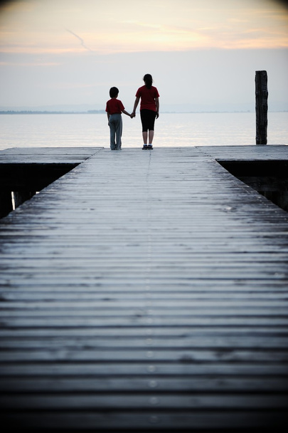 Sister and brother on wooden dock - Foto, immagini
