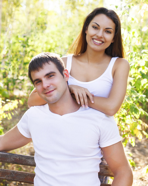 Cute couple in the park on a sunny day - Photo, Image