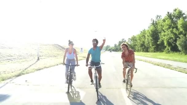 adults cycling and taking selfies - Footage, Video