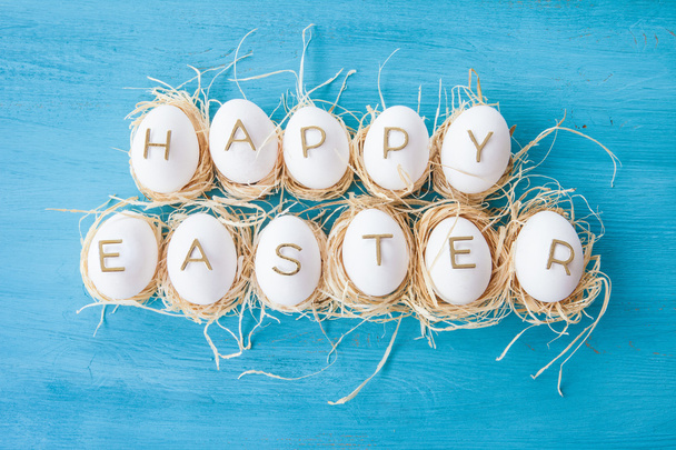 Chicken eggs with easter greeting - Foto, Imagen