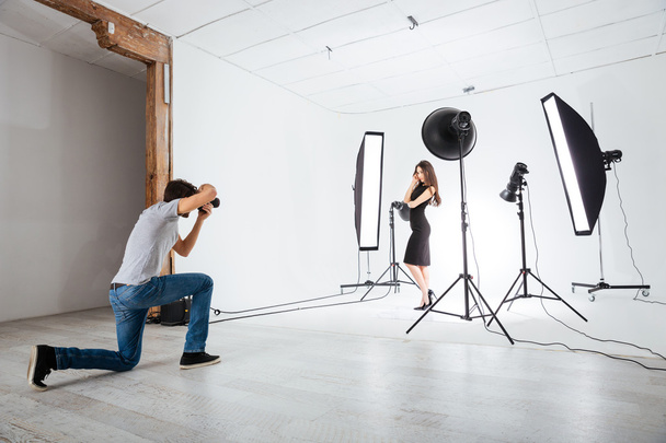 Photographer working with model in studio  - Zdjęcie, obraz