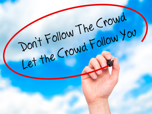 Man Hand writing Don't Follow The Crowd Let the Crowd Follow You - Foto, Imagen