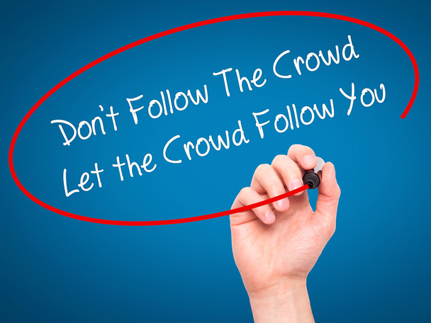 Man Hand writing Don't Follow The Crowd Let the Crowd Follow You - Foto, Imagen