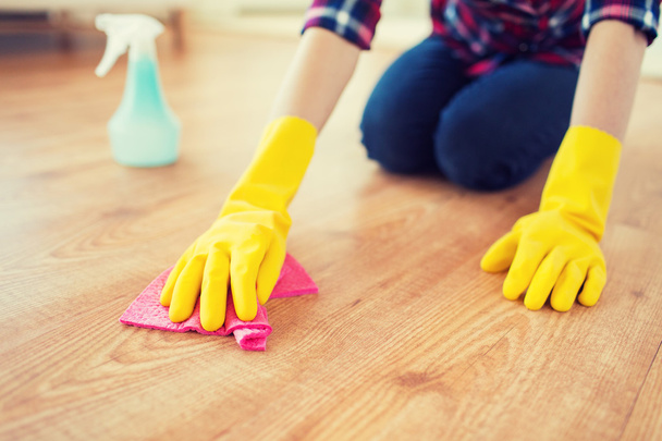 close up of woman with rag cleaning floor at home - Foto, Imagem