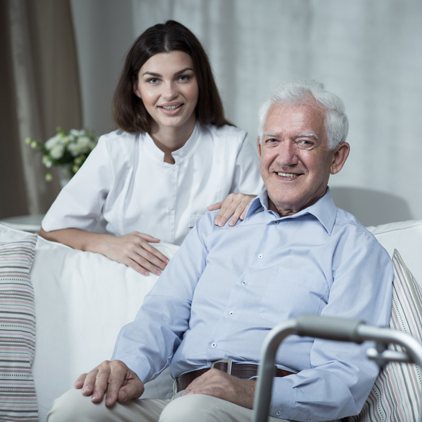 Fogyatékkal élő idősebb férfi és nővér - Fotó, kép
