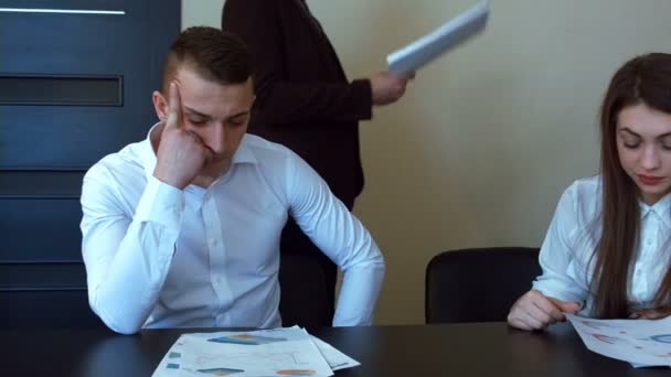 Businesswoman in office gets reprimand from her boss - Video