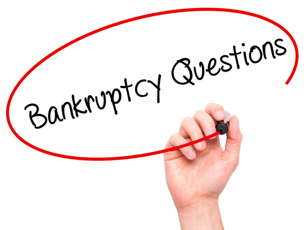 Man Hand writing Bankruptcy Questions with black marker on visua - Photo, Image