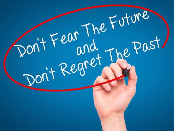 Man Hand writing Don 't Fear The Future and Don' t Regret The Past
 - Фото, изображение