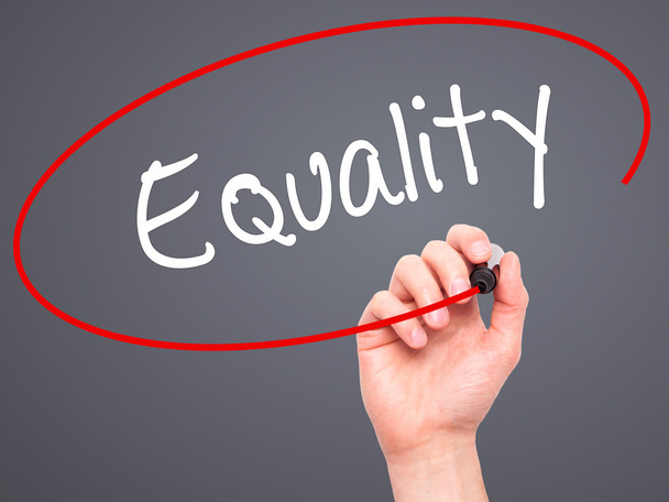 Man Hand writing Equality  with black marker on visual screen - Photo, Image