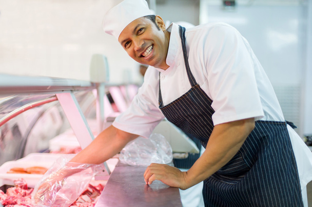 butcher picking fresh meat - Foto, imagen