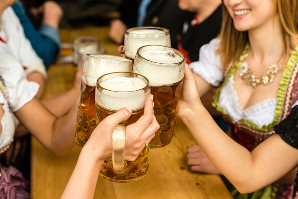 Bavarian girls drinking beer - Photo, Image