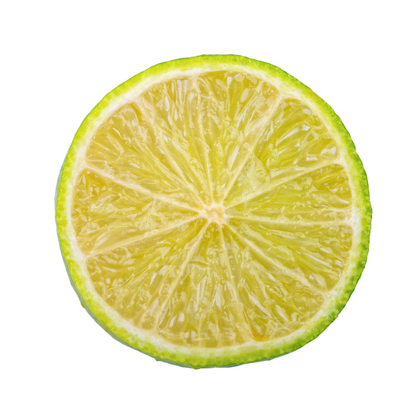 Cut lime on a white background - Фото, изображение