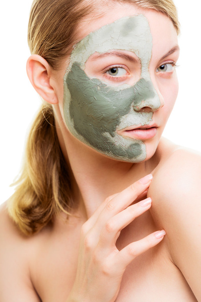 Woman in clay mud mask - 写真・画像