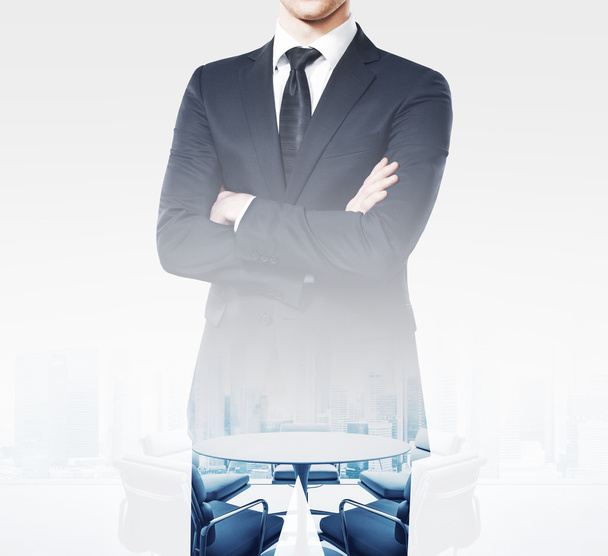 Young businessman wearing modern suit and stands in empty meeting room. Double exposure, square - Foto, Imagem